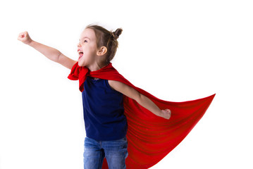 Adorable little girl flying like a superhero in blue t-shirt and red mantle. Super girl. The new...