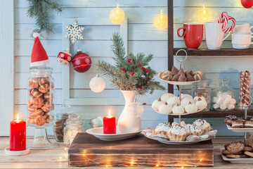 Christmas bar cacao decoration with cookies and sweets on blue wooden background in vintage style