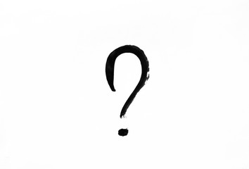 Question mark drawn in black paint on white paper.