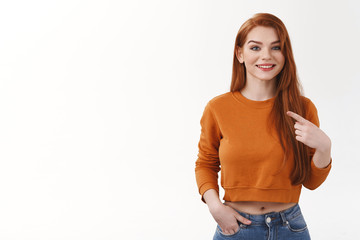 Obraz premium Girl believe herself proving she worth job right candidature. Carefree relaxed pleasant smiling urban attractive redhead woman pointing own chest proudly boastful explain own achievements was picked