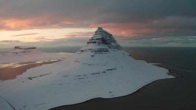 Bird's-eye view of the snowy Mount Kirkjufetl. Iceland, winter 2019.