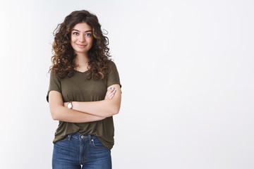 Sassy attractive confident freelance armenian girl with curly hair standing self-assured arms...