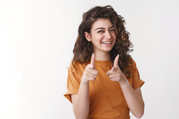 Lucky you bastard. Happy charming young female friend congratulating you pointing finger pistols...