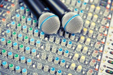 Microphones on the sound mixer in the studio for recording, editing, and sound system control concept.
