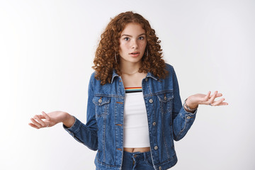 Why so fuss. Pressured displeased teenage girl standing clueless shocked shrugging hands sideways...