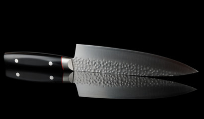 New Japanese kitchen knife isolated on black