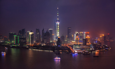 Pudong financial district with Oriental Pearl tower by night. Shanghai, China