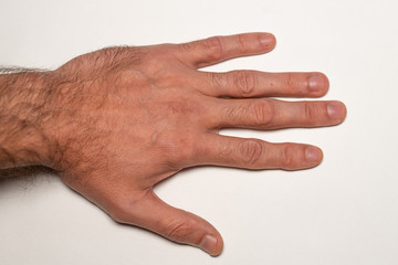 Male hairy hand close up, top view