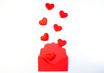 Valentine`s day, red hearts from the red envelope isolated on white background