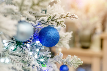 Christmas background-colored toys hang on the Christmas tree