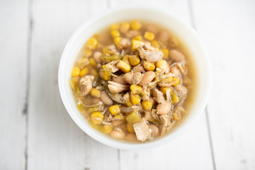Flavorful White Chicken Chili made with hearty beans, tender chicken, and a rich and creamy broth in slow cooker