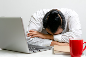 businessman upset at an office desk Business people who are stressed and depressed from working in the office