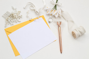 Flat lay shot of letter and eco paper envelope on white background. Wedding invitation cards. Valentine's day or other holiday concept, top view, flat lay, overhead view