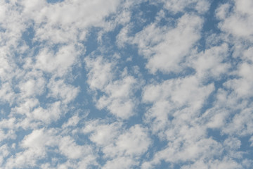 Clouds cover a blue sky