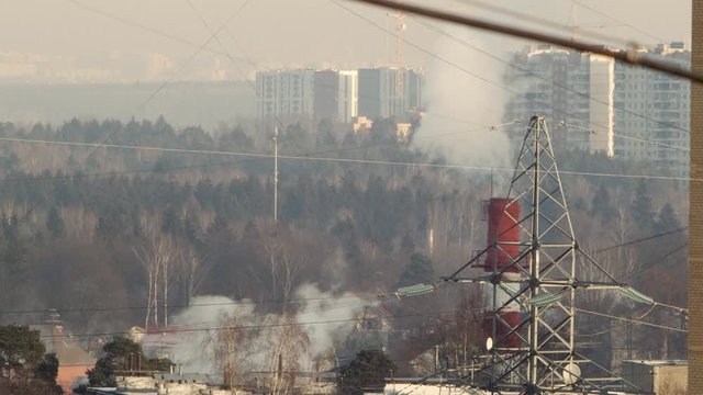 Russian town Troitsk. Houses, power lines and steam coming from the steamshop pipe