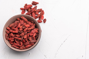 Goji berries isolated on white background. Healthy eating, copy space.