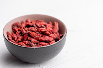 Goji berries isolated on white background. Healthy eating, copy space.