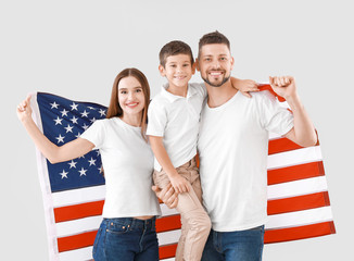 Family with USA flag on light background. Memorial Day celebration