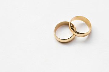 two golden wedding rings isolated on white, wedding rings background concept