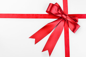 Beautiful red ribbons with bow on white background