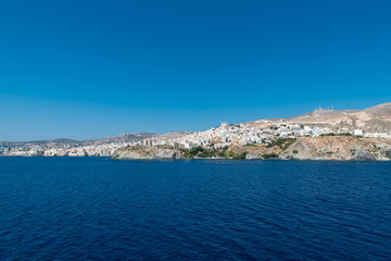 Naklejka na ściany i meble Syros island as seen when entering the port from the ship, Cyclades, Greece