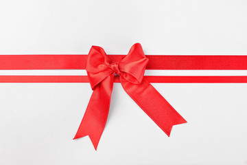 Beautiful red ribbons with bow on white background