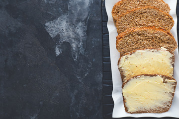 Tasty fresh bread with butter on table