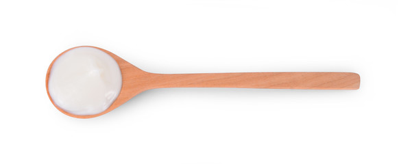 wood spoon of sour cream yogurt isolated on white background