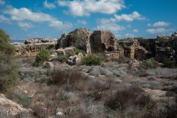 Fototapeta premium The rocks and former quarries of ancient Paphos are very similar to the foundations of the walls, towers, ditches and counterscarps of medieval fortifications. Is that so? Riddle. 