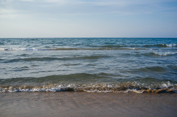 Fototapeta na wymiar Soft Sea Ocean Waves Wash Over shore