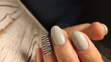 Obraz na płótnie Canvas Closeup photo of a beautiful female hands with elegant manicure