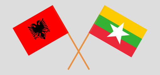 Crossed flags of Myanmar and Albania