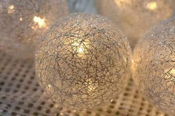 Christmas garland luminous balls of silver color.
