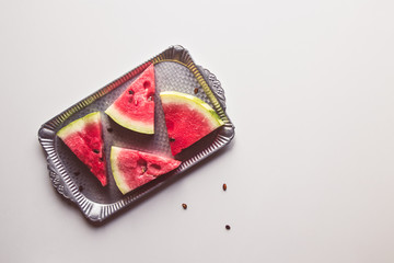 closeup of some pieces of refreshing watermelon on a white background