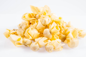Sacchettini pasta on a white background