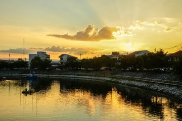 Fototapeta premium Sunset over the river in the city