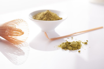  Matcha green tea powder view from above, traditional matcha tea preparing , white background. 