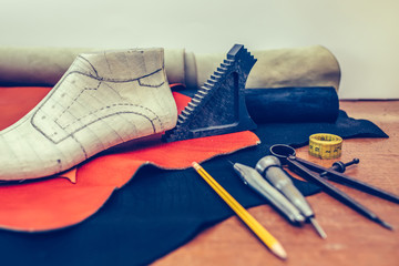 Small shoemaker workplace with tools.