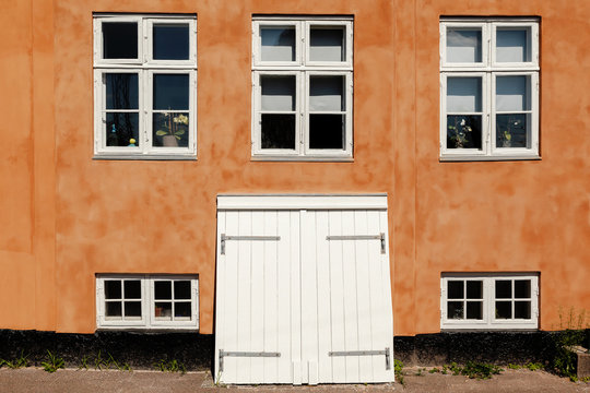 Orange Typically Danish House with Windows and Cellardoor