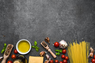 Italian food, ingredients of spaghetti: pasta, parmesan, olive oil, basil