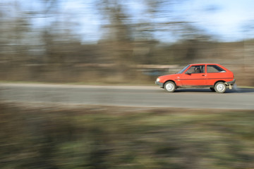 Fototapeta na wymiar A red car is racing.