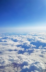 flying by plane over the ceiling of clouds