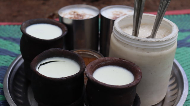 Milk drinks in traditional clay pots. Lassi in rural india.