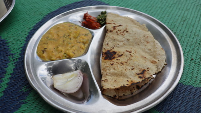 Traditional Maharastrian food served with curry. 