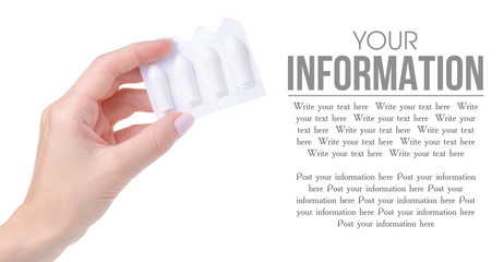 Suppositories in hand health medicine on a white background. Isolation, space for text