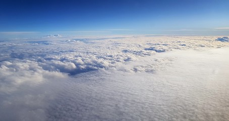 a landscape above the clouds