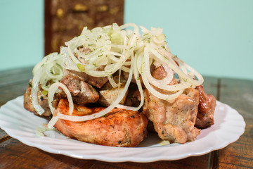 Freshly cooked tasty barbecue on a large wooden table