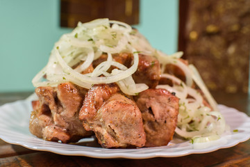 Freshly cooked tasty barbecue on a large wooden table
