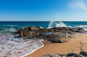 On a beach in Lloret de Mar, water in peace and movement