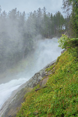 Spray floating through the air at the Krimml Waterfalls seen from the Regen Kanzel on the path to the upper part of the waterfall